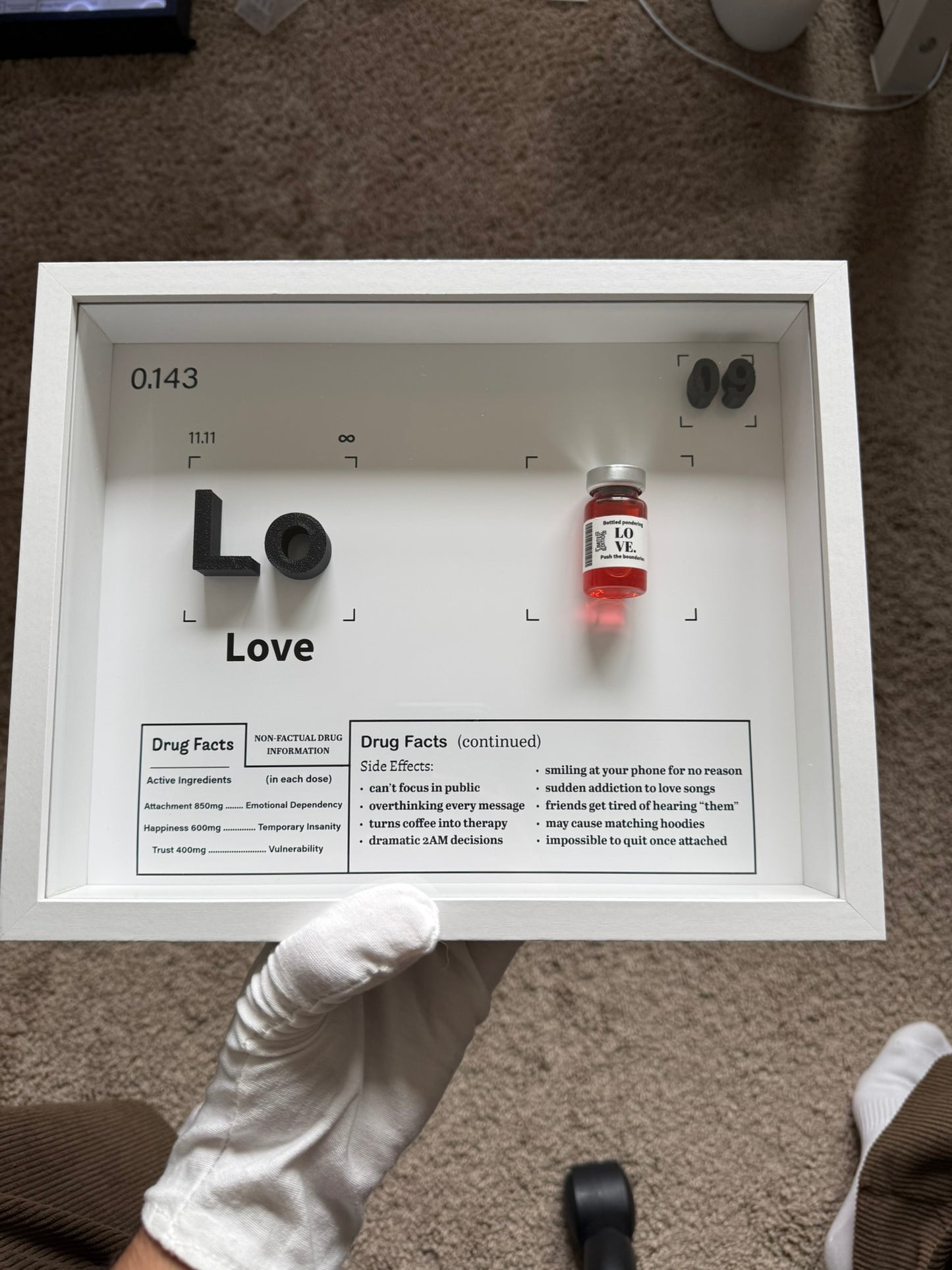 Handmade Love periodic-element shadow box with a bottled-love vial and Love Facts panel