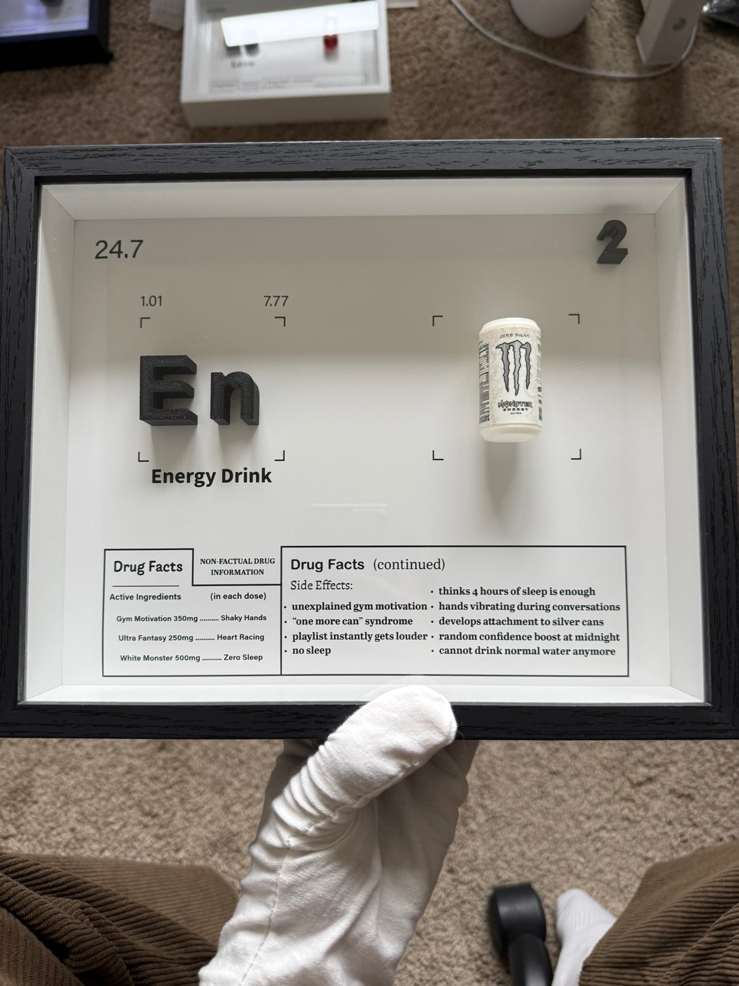 Handmade shadow box with a real energy-drink can and a Drug Facts parody panel