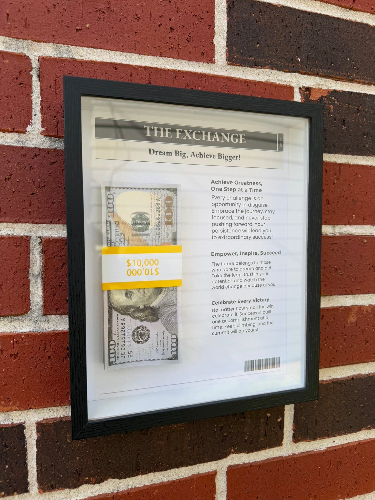 Handmade money shadow box styled like a newspaper feature with prop bills