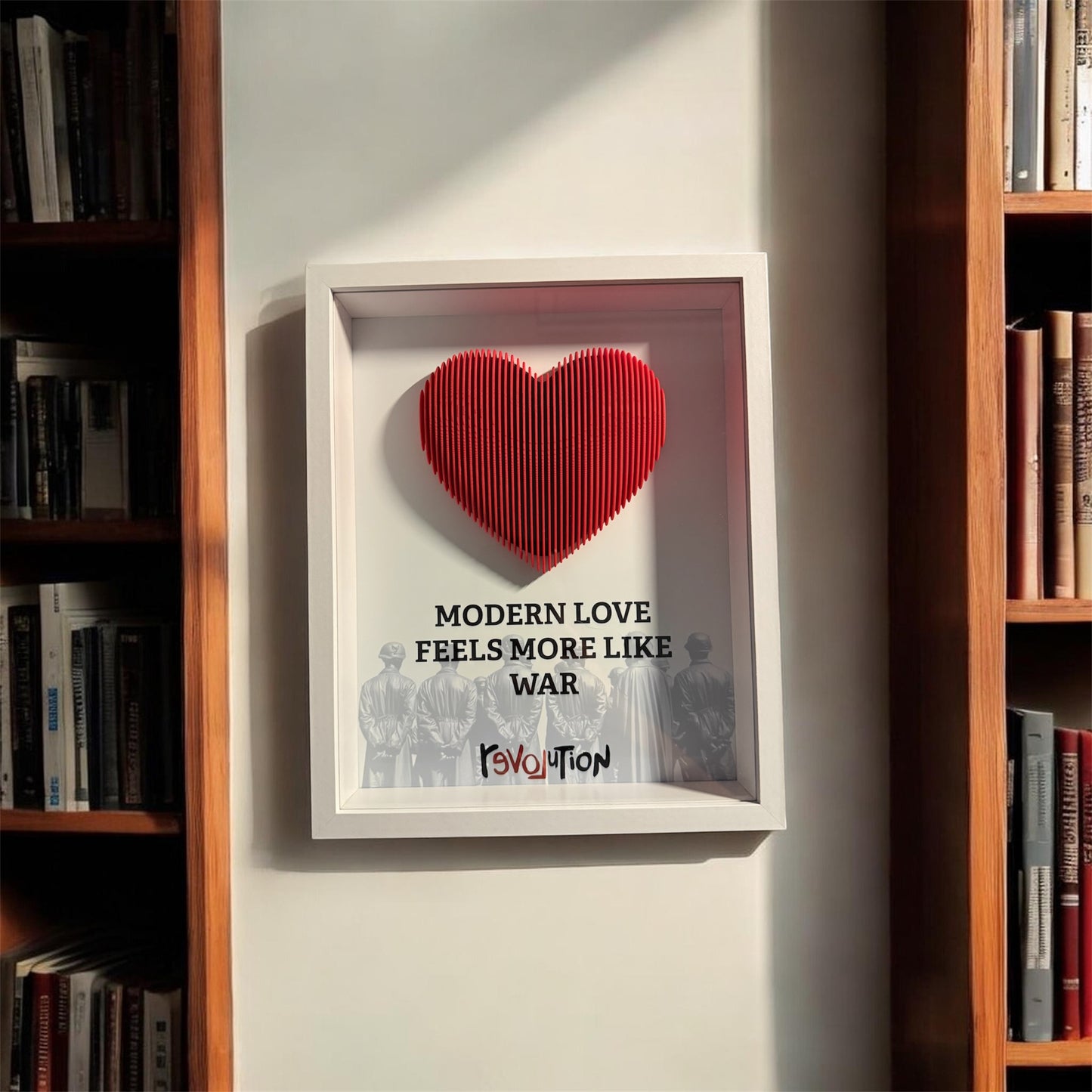 Handmade shadow box with a sculpted red 3D heart and the word revolution