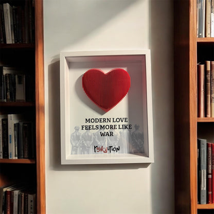Handmade shadow box with a sculpted red 3D heart and the word revolution